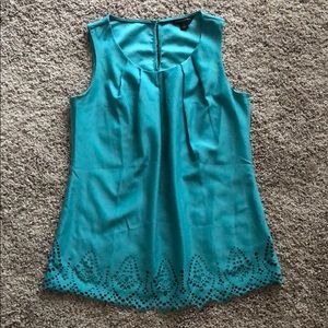 Laser cut sleeveless teal blouse